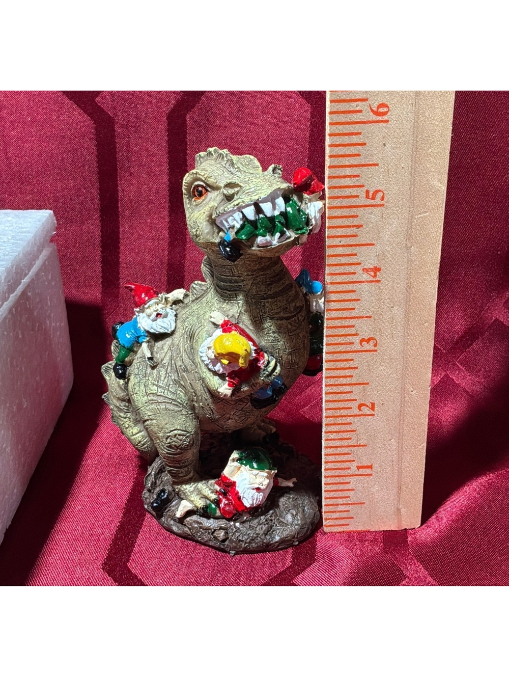 Dinosaur Figurine with Gnome Decorations